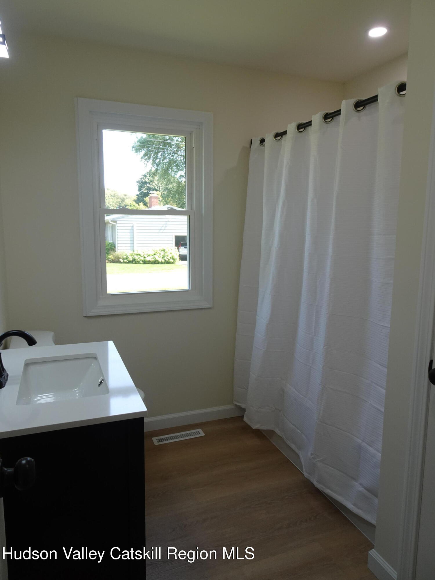 8 Hover Road Claverack-Red Mills, NY 12513 - Photo 28 of 33 a room with a window a sink and a mirror