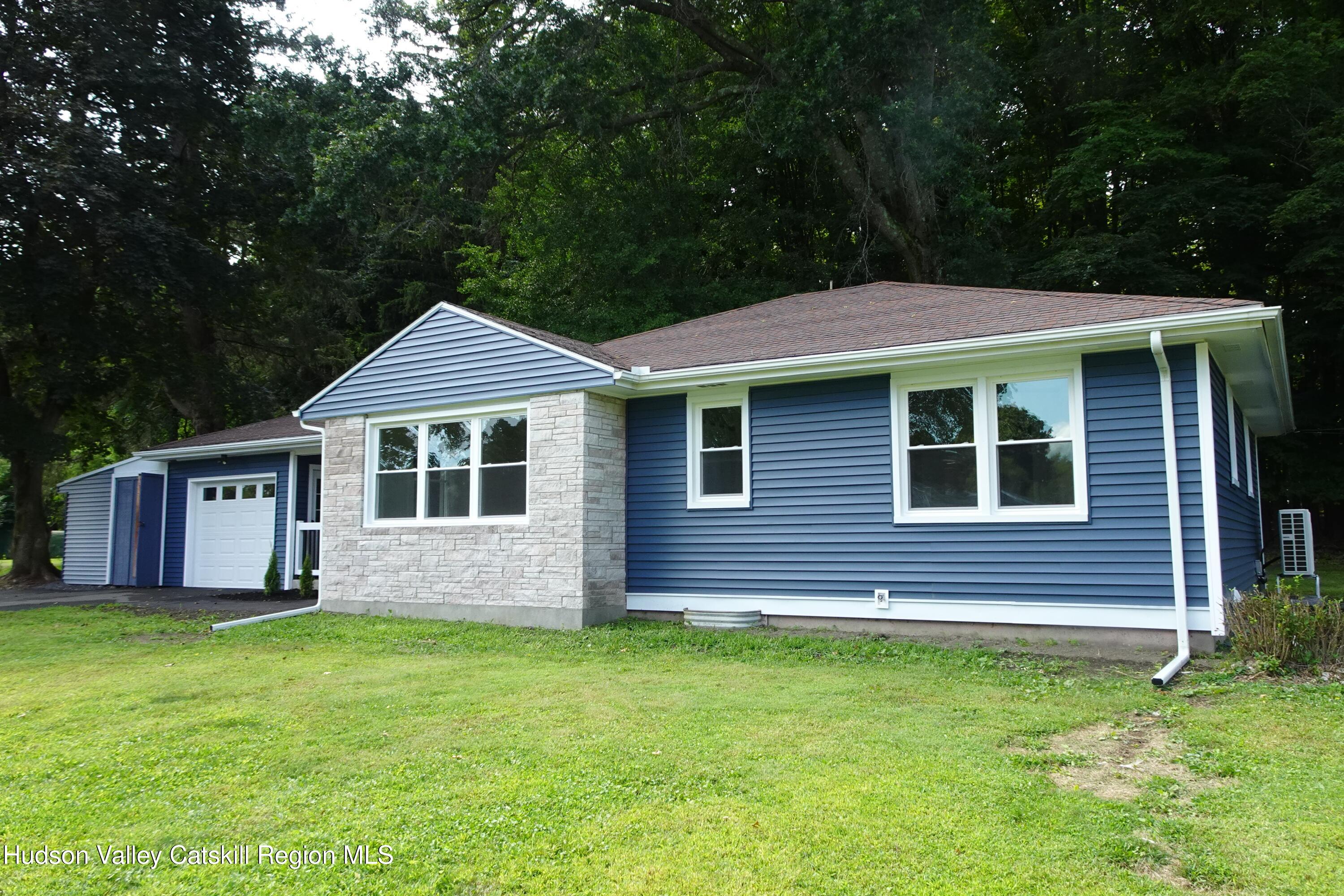 8 Hover Road Claverack-Red Mills, NY 12513 - Photo 29 of 33 a front view of a house with a garden