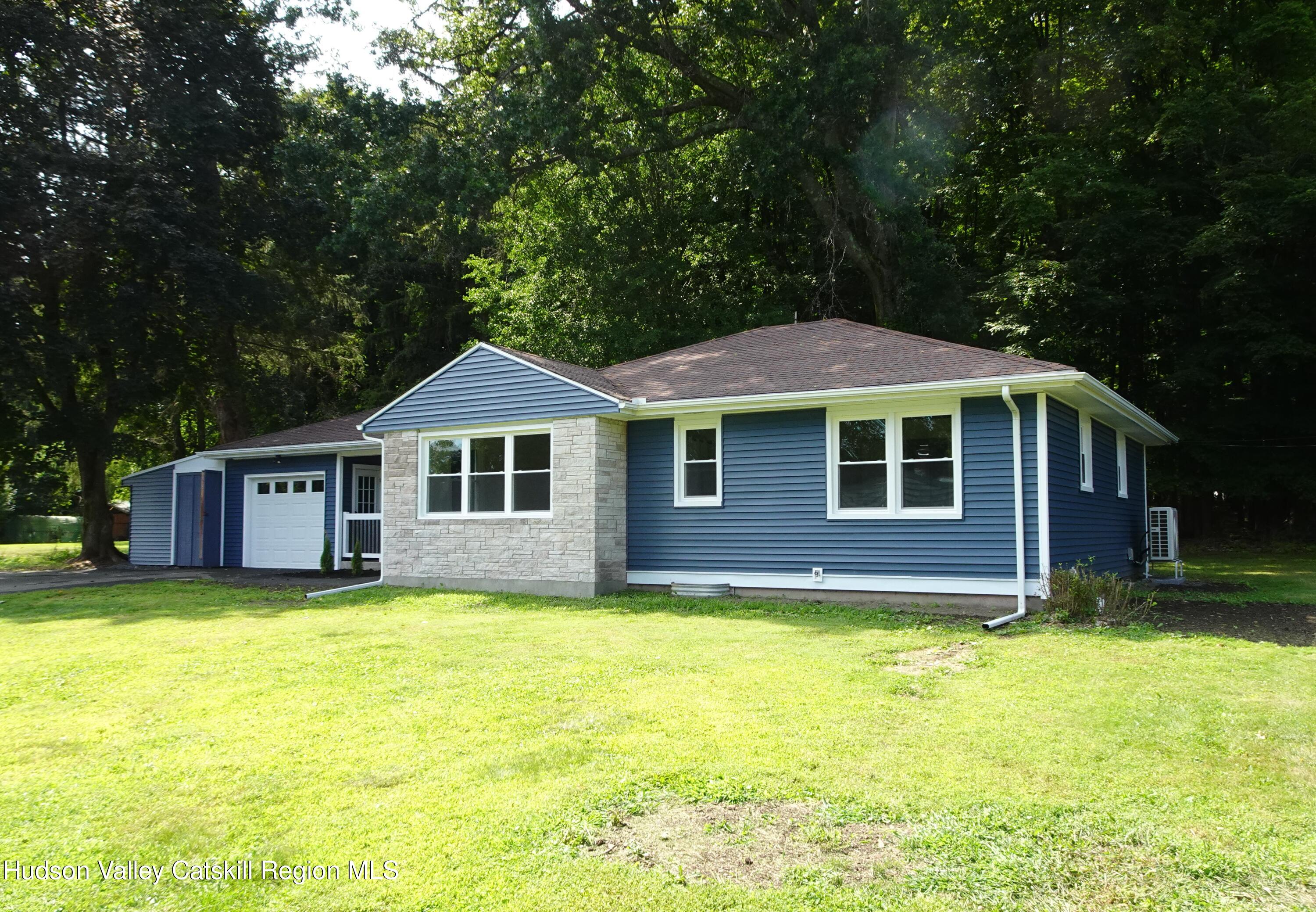8 Hover Road Claverack-Red Mills, NY 12513 - Photo 3 of 33 a front view of a house with a yard