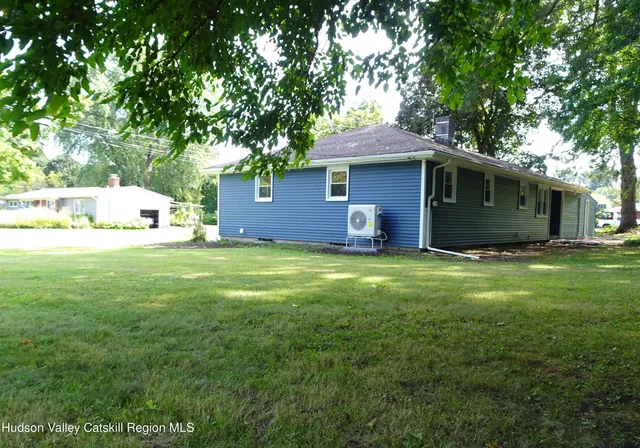 a view of a house with a yard