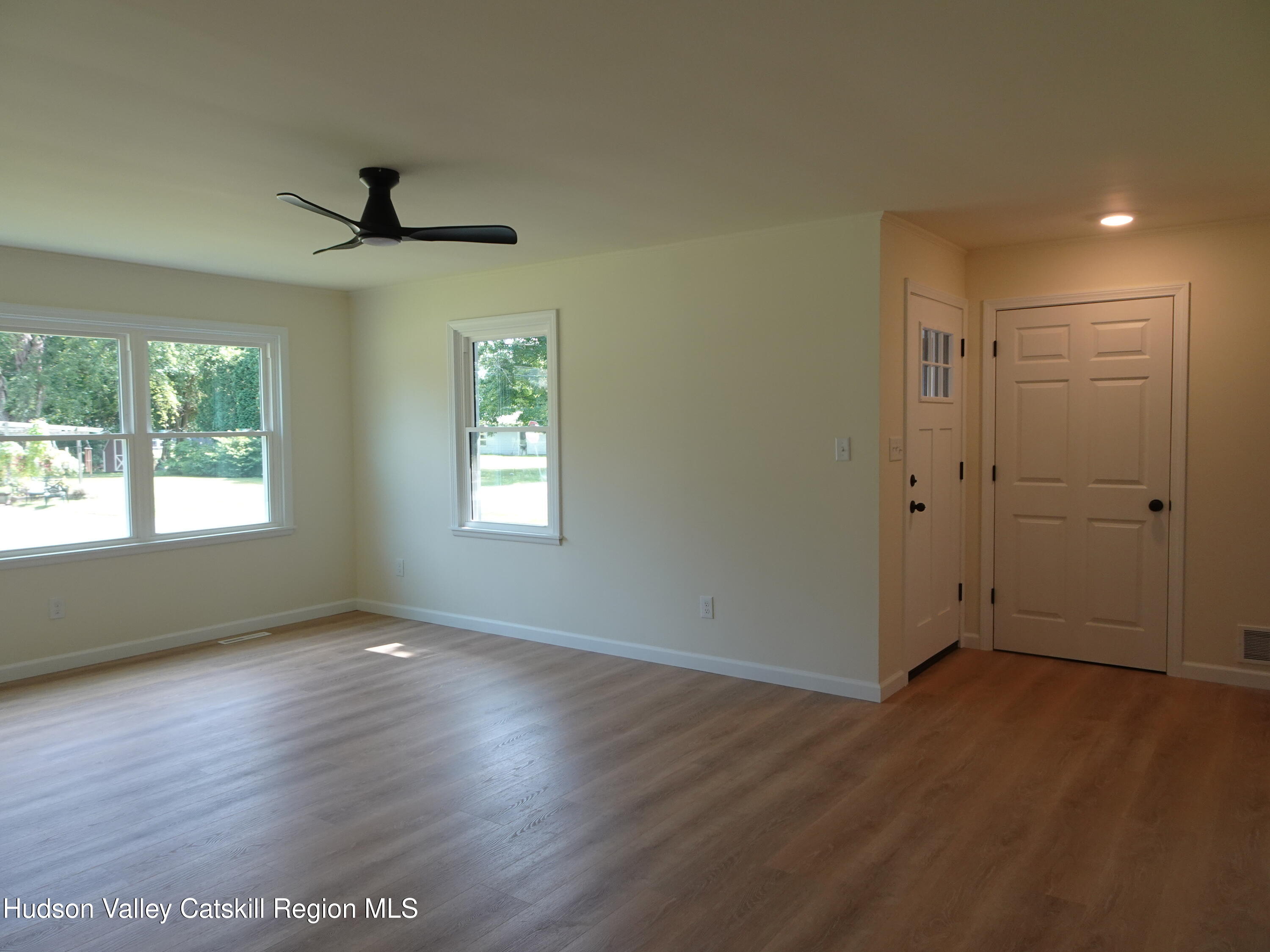 8 Hover Road Claverack-Red Mills, NY 12513 - Photo 8 of 33 a view of an empty room with wooden floor and a window