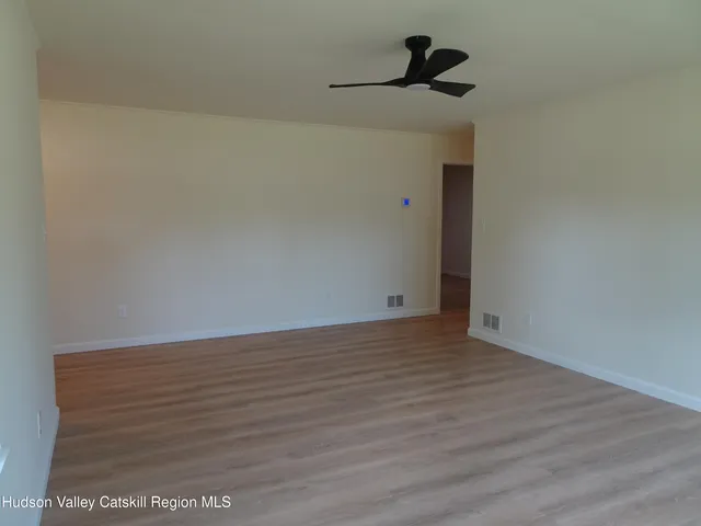 a view of a ceiling fan in a room