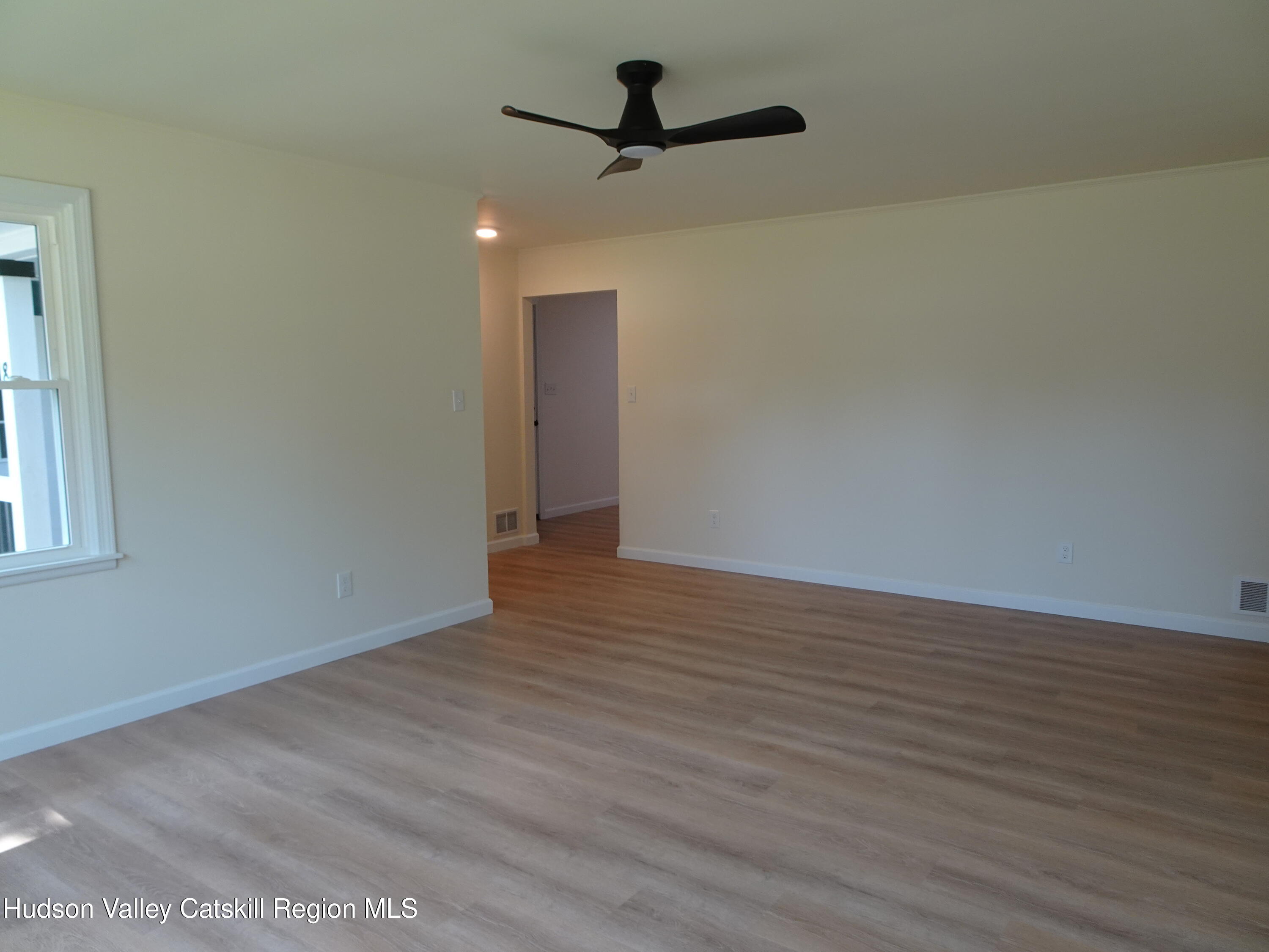 8 Hover Road Claverack-Red Mills, NY 12513 - Photo 10 of 33 a view of an empty room with wooden floor and a window
