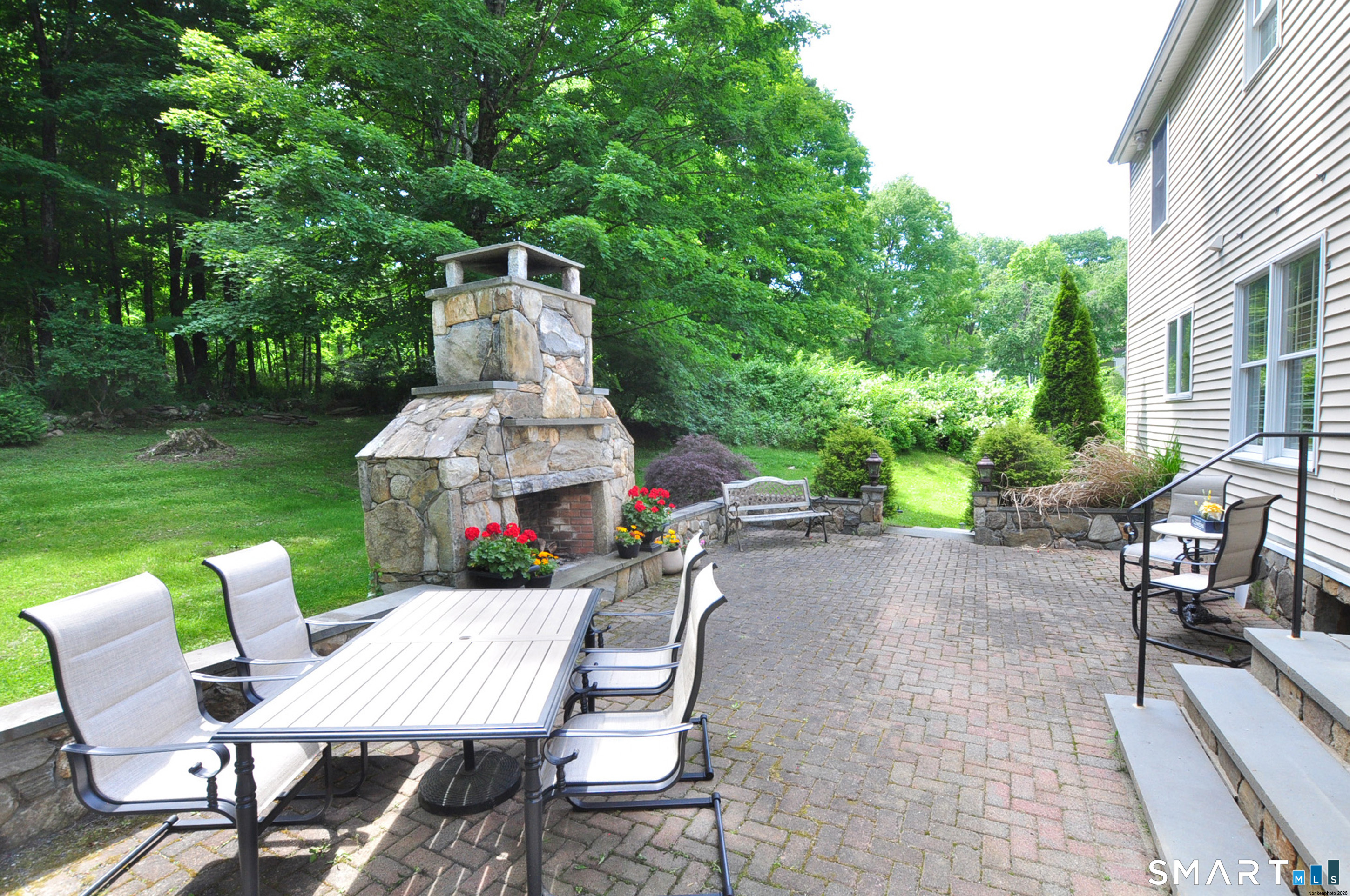 12 Revere Road Bridgewater, CT 06752 - Photo 40 of 40 a view of a chairs and table in backyard of the house