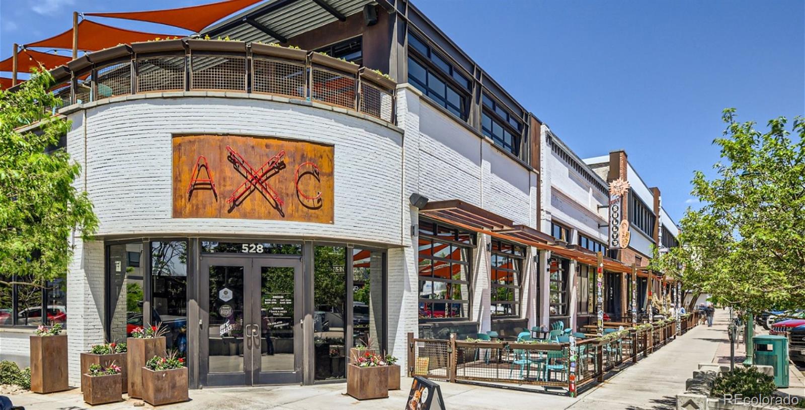 8962 Blue Feather Loop Colorado Springs, CO 80908 - Photo 16 of 18 a front view of a multi story building with yard