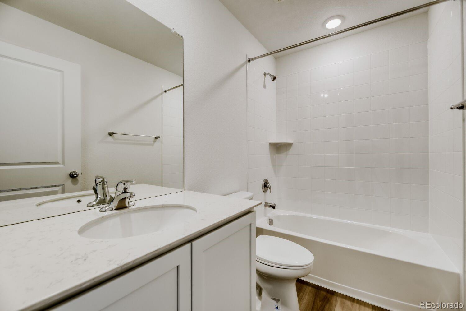 8962 Blue Feather Loop Colorado Springs, CO 80908 - Photo 10 of 18 a bathroom with a sink toilet and shower