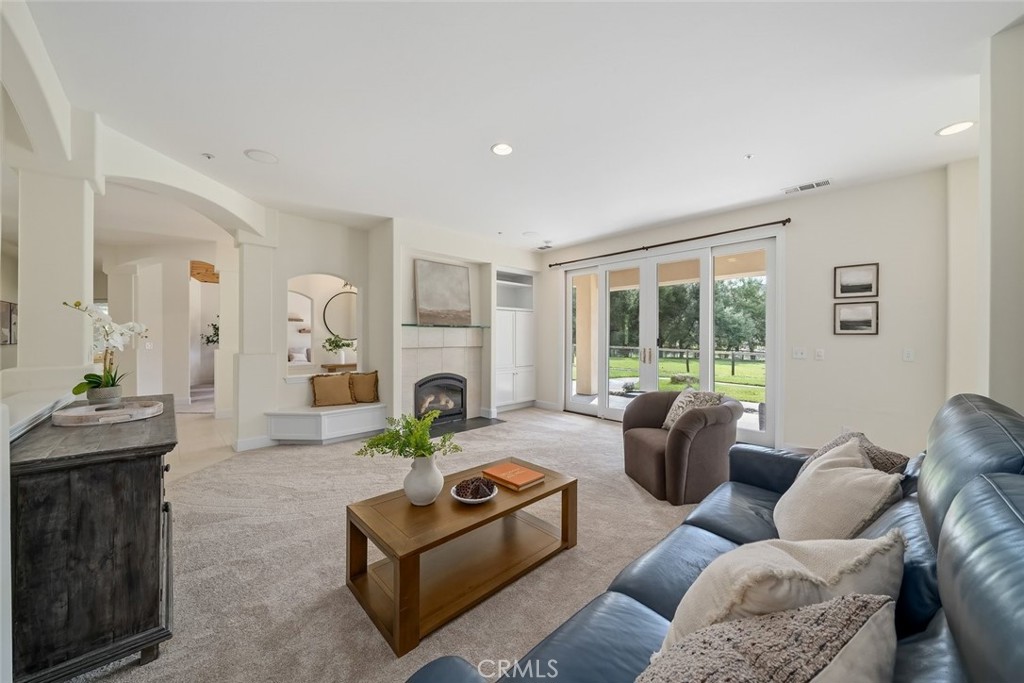 1825 Hi Mountain Road Arroyo Grande, CA 93420 - Photo 13 of 74 a living room with furniture fireplace and a large window