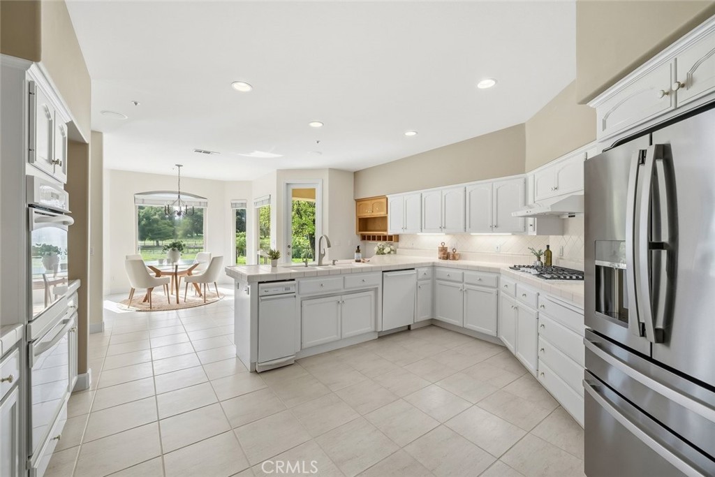 1825 Hi Mountain Road Arroyo Grande, CA 93420 - Photo 19 of 74 a kitchen with a refrigerator and a sink