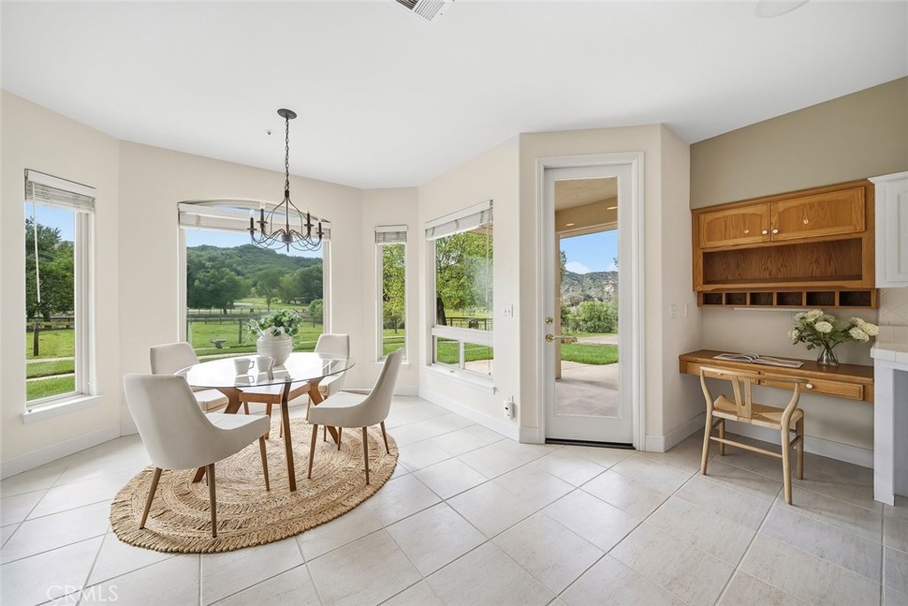 1825 Hi Mountain Road Arroyo Grande, CA 93420 - Photo 20 of 74 a dining room with furniture a chandelier and wooden floor