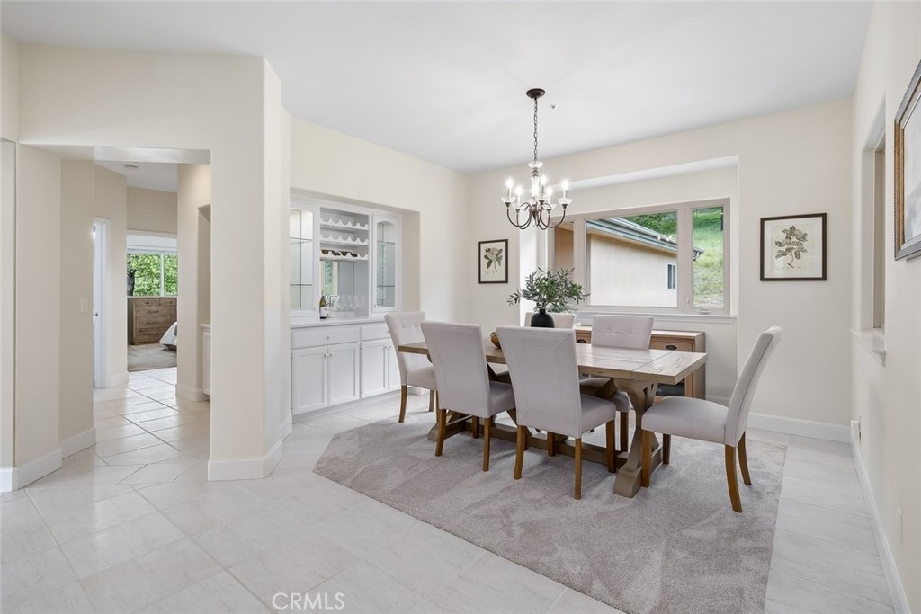 1825 Hi Mountain Road Arroyo Grande, CA 93420 - Photo 22 of 74 a view of a dining room with furniture and chandelier