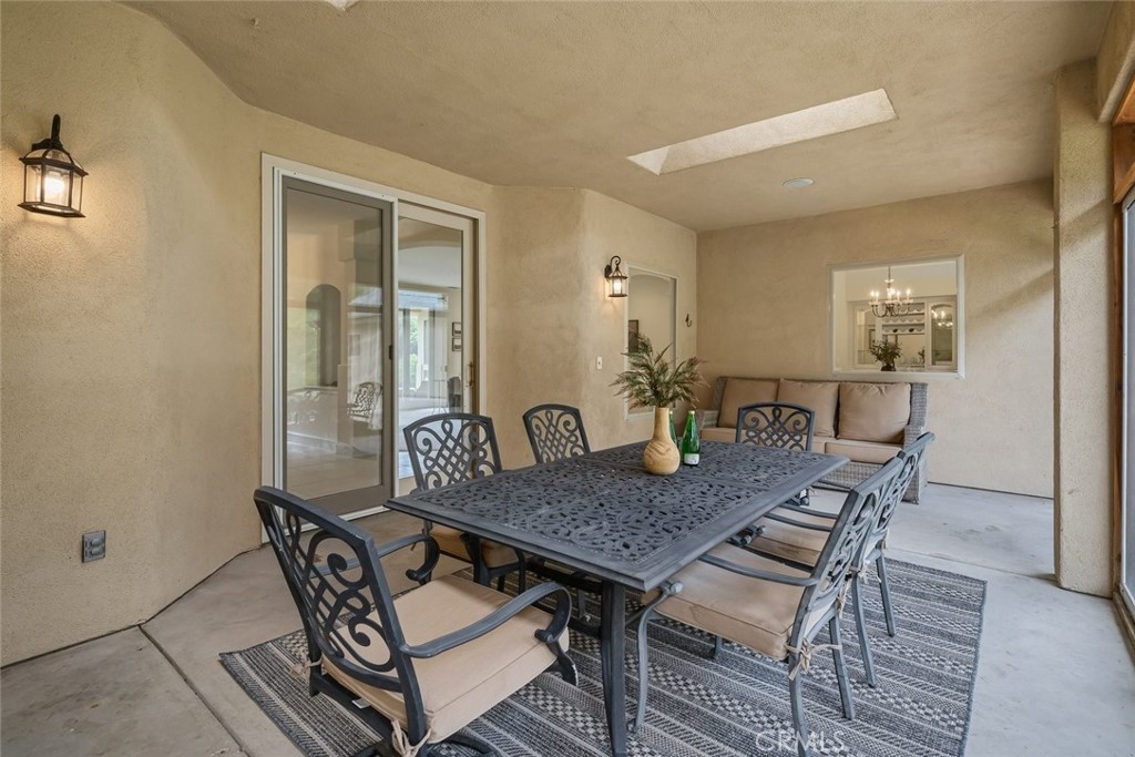 1825 Hi Mountain Road Arroyo Grande, CA 93420 - Photo 24 of 74 a dining room with furniture and wooden floor