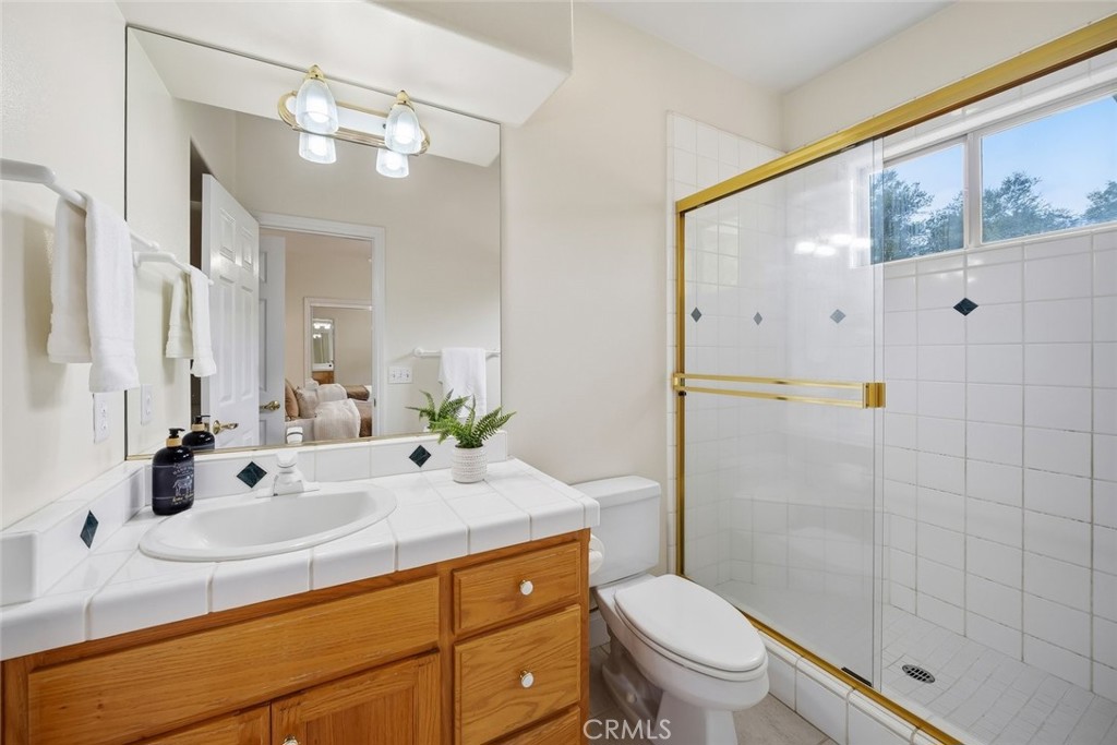 1825 Hi Mountain Road Arroyo Grande, CA 93420 - Photo 35 of 74 a bathroom with a sink a toilet and shower