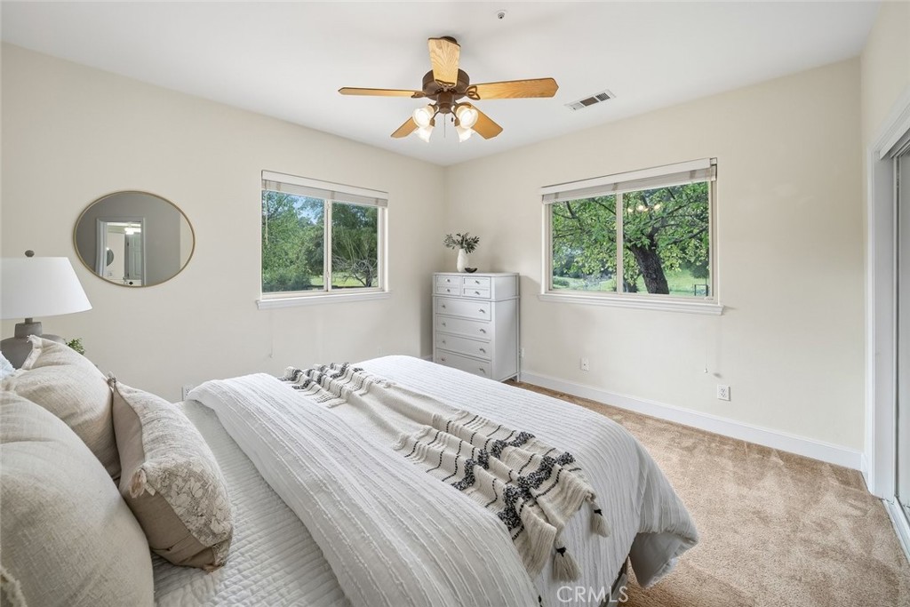 1825 Hi Mountain Road Arroyo Grande, CA 93420 - Photo 36 of 74 a bedroom with a large bed and a window