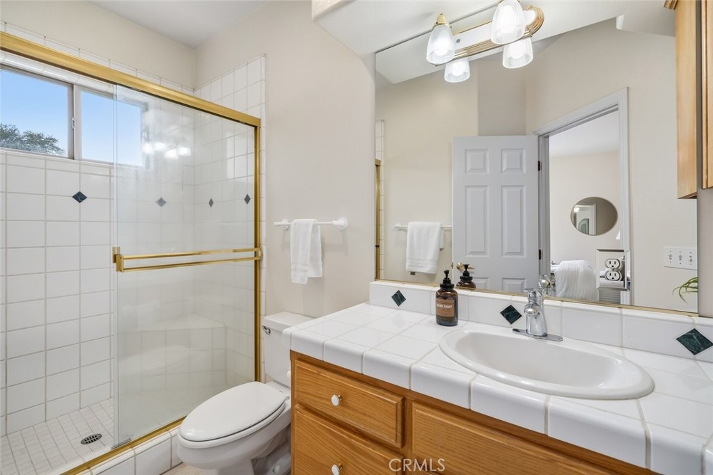 1825 Hi Mountain Road Arroyo Grande, CA 93420 - Photo 38 of 74 a bathroom with a double vanity sink mirror and shower