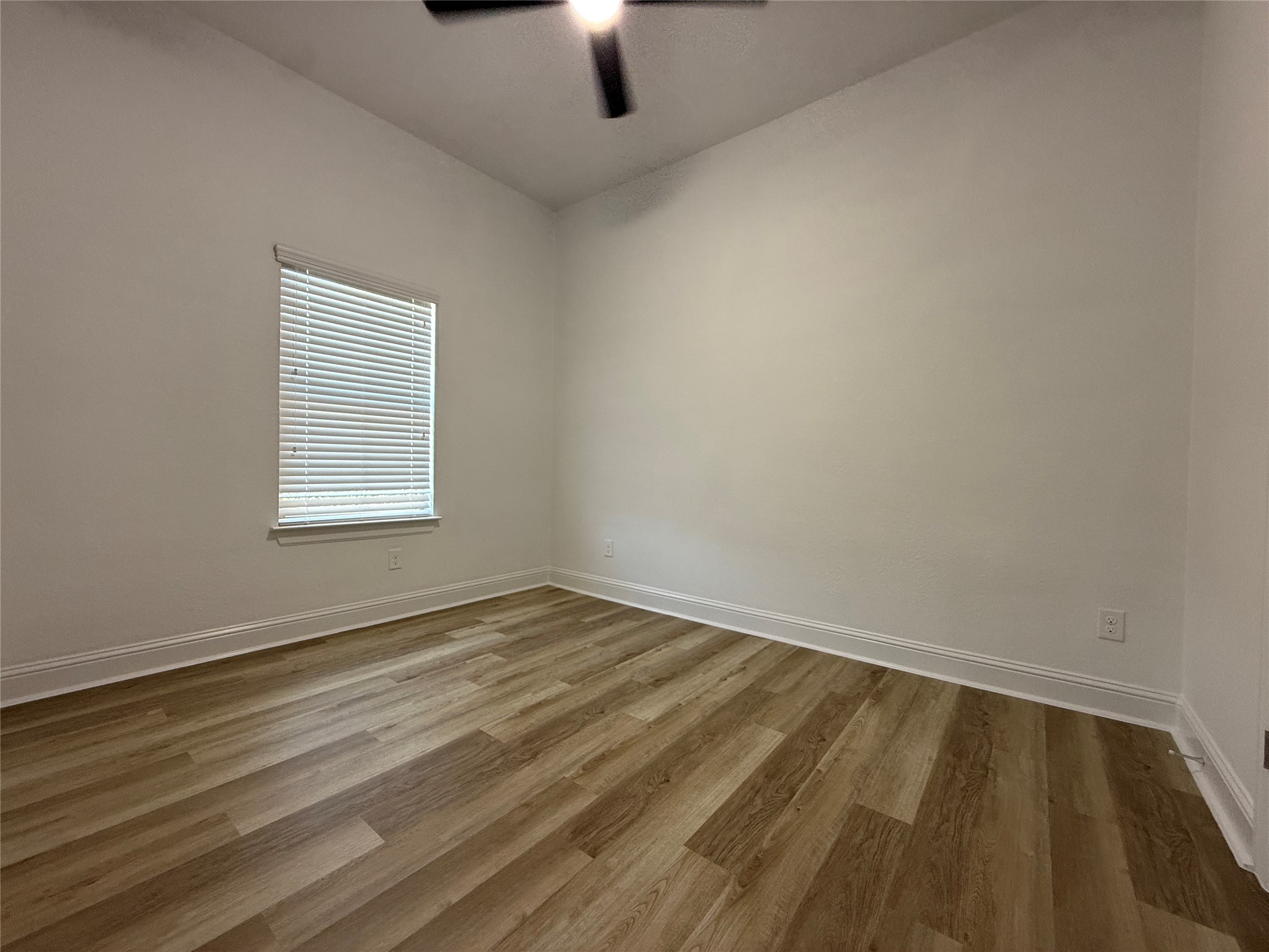 1512 Long Shadow Lane Georgetown, TX 78628 - Photo 15 of 19 wooden floor in an empty room with a window
