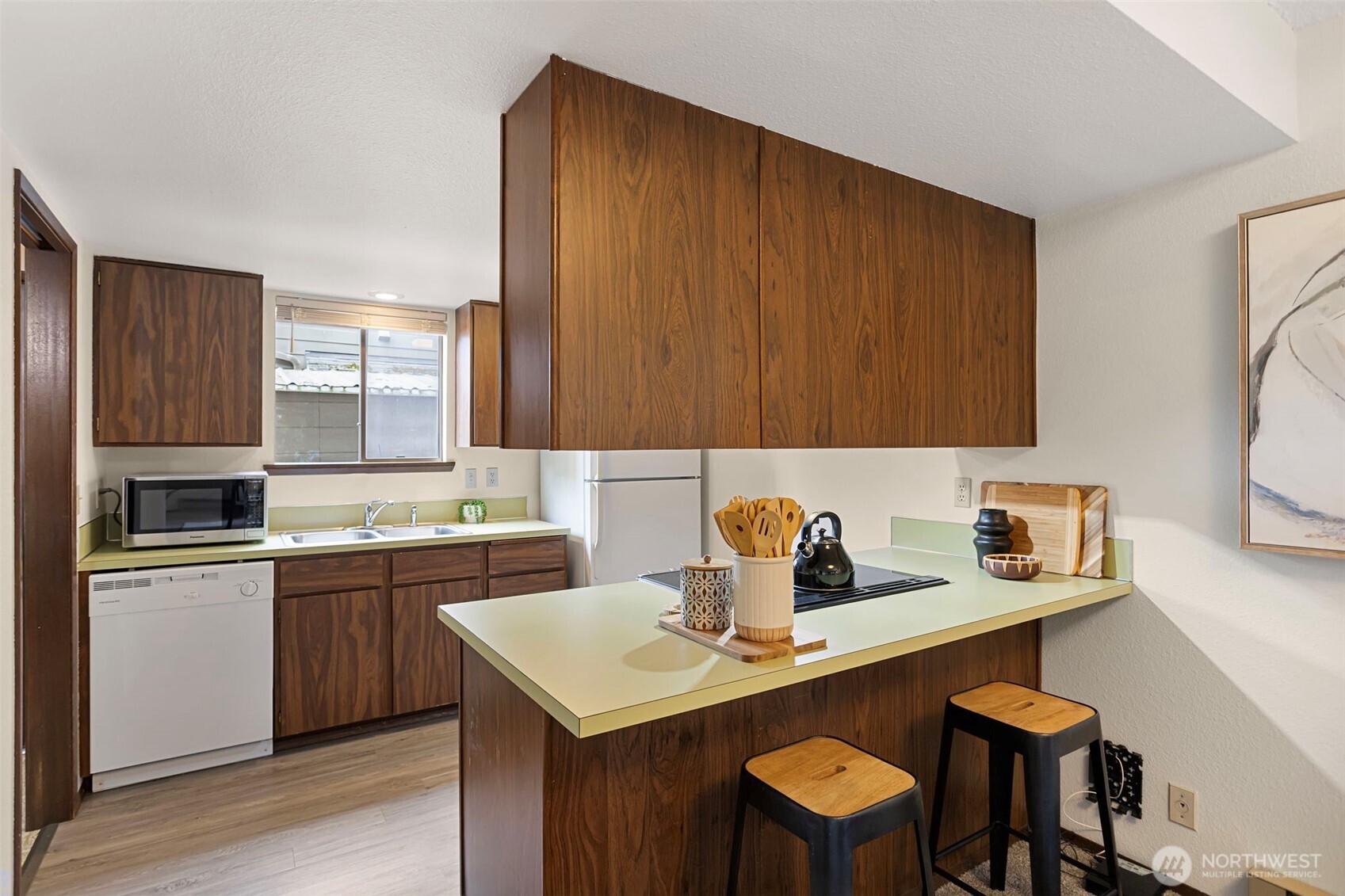9545 Interlake Avenue North Seattle, WA 98103 - Photo 11 of 32 a kitchen with a sink cabinets and appliances