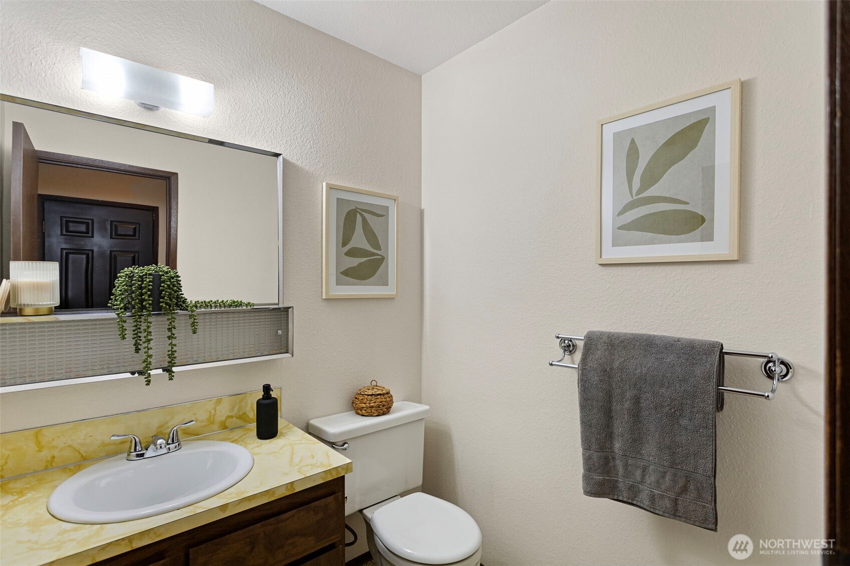 9545 Interlake Avenue North Seattle, WA 98103 - Photo 18 of 32 a bathroom with a toilet sink and mirror