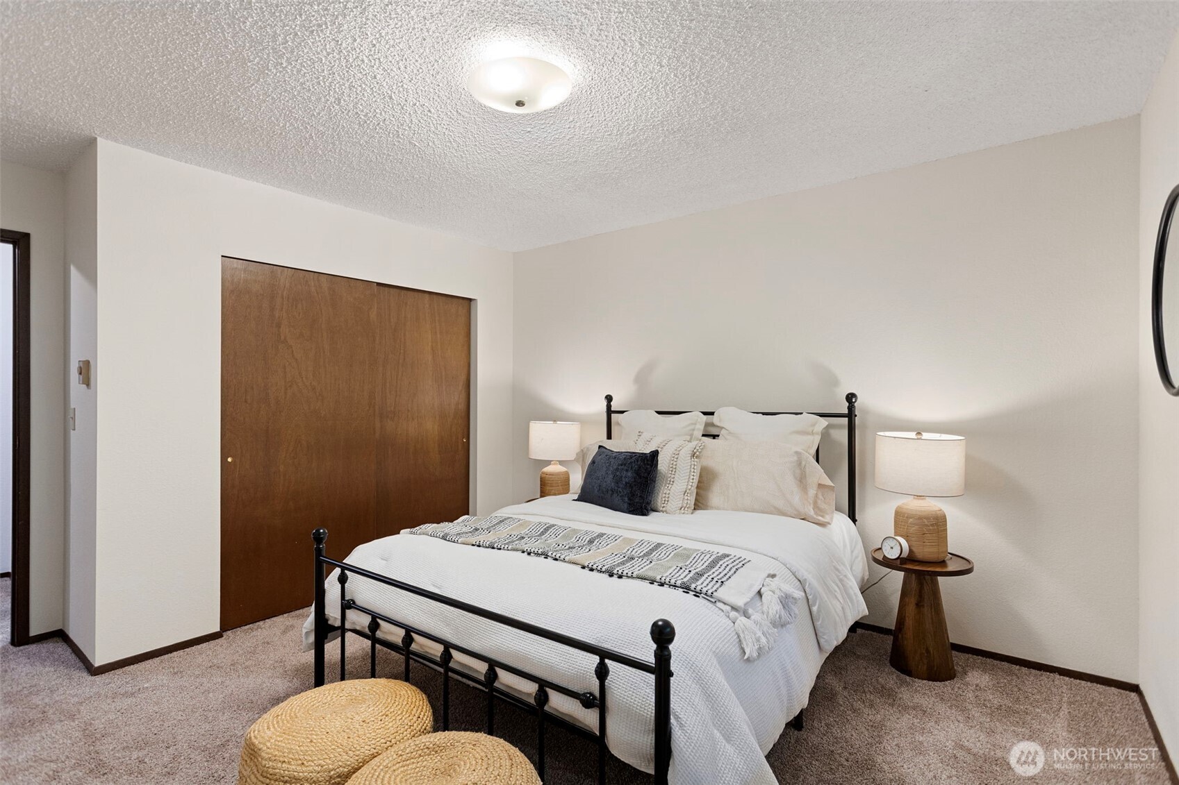 9545 Interlake Avenue North Seattle, WA 98103 - Photo 20 of 32 a bedroom with a bed and a lamp