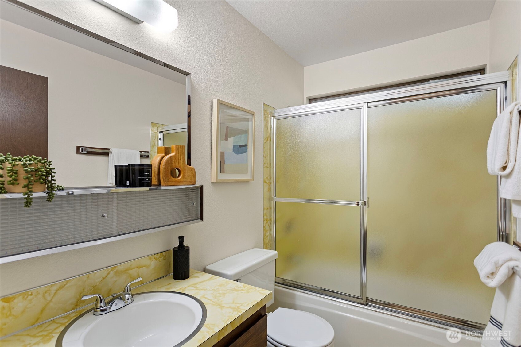 9545 Interlake Avenue North Seattle, WA 98103 - Photo 22 of 32 a bathroom with a sink toilet and shower