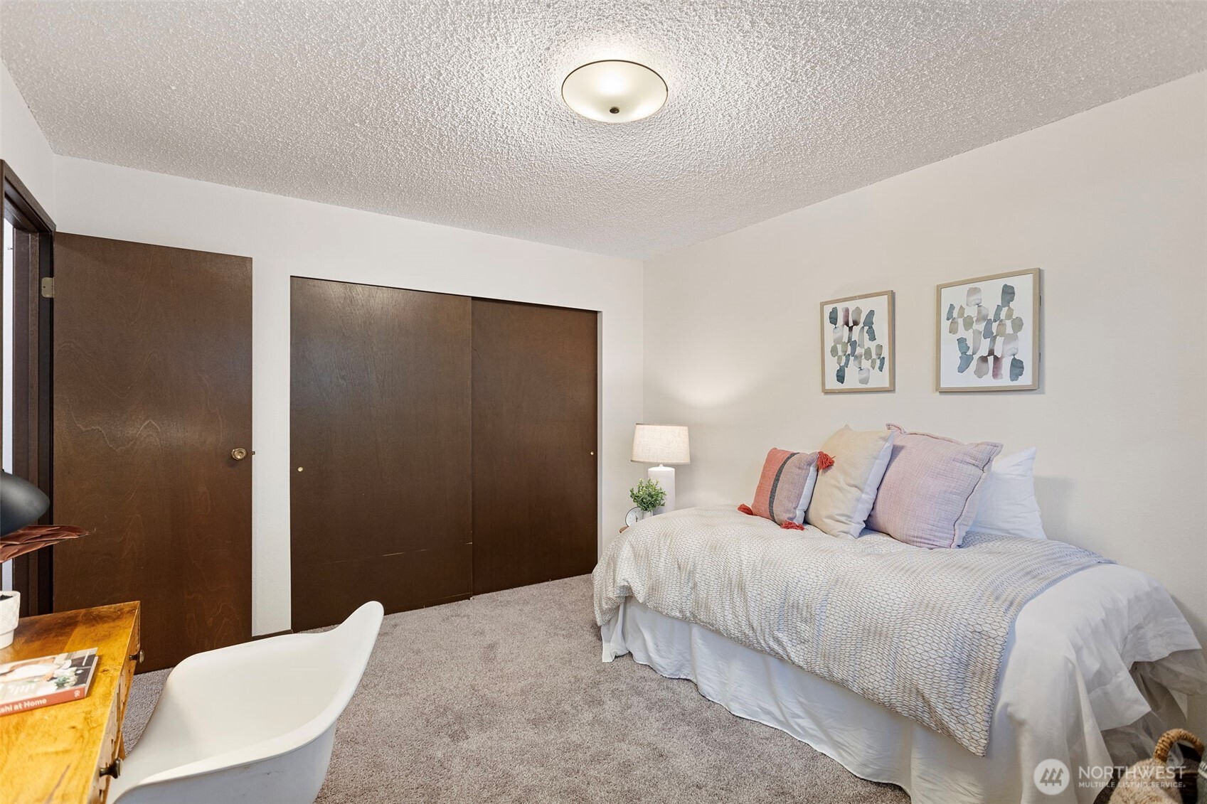 9545 Interlake Avenue North Seattle, WA 98103 - Photo 24 of 32 a bedroom with a bed and a table