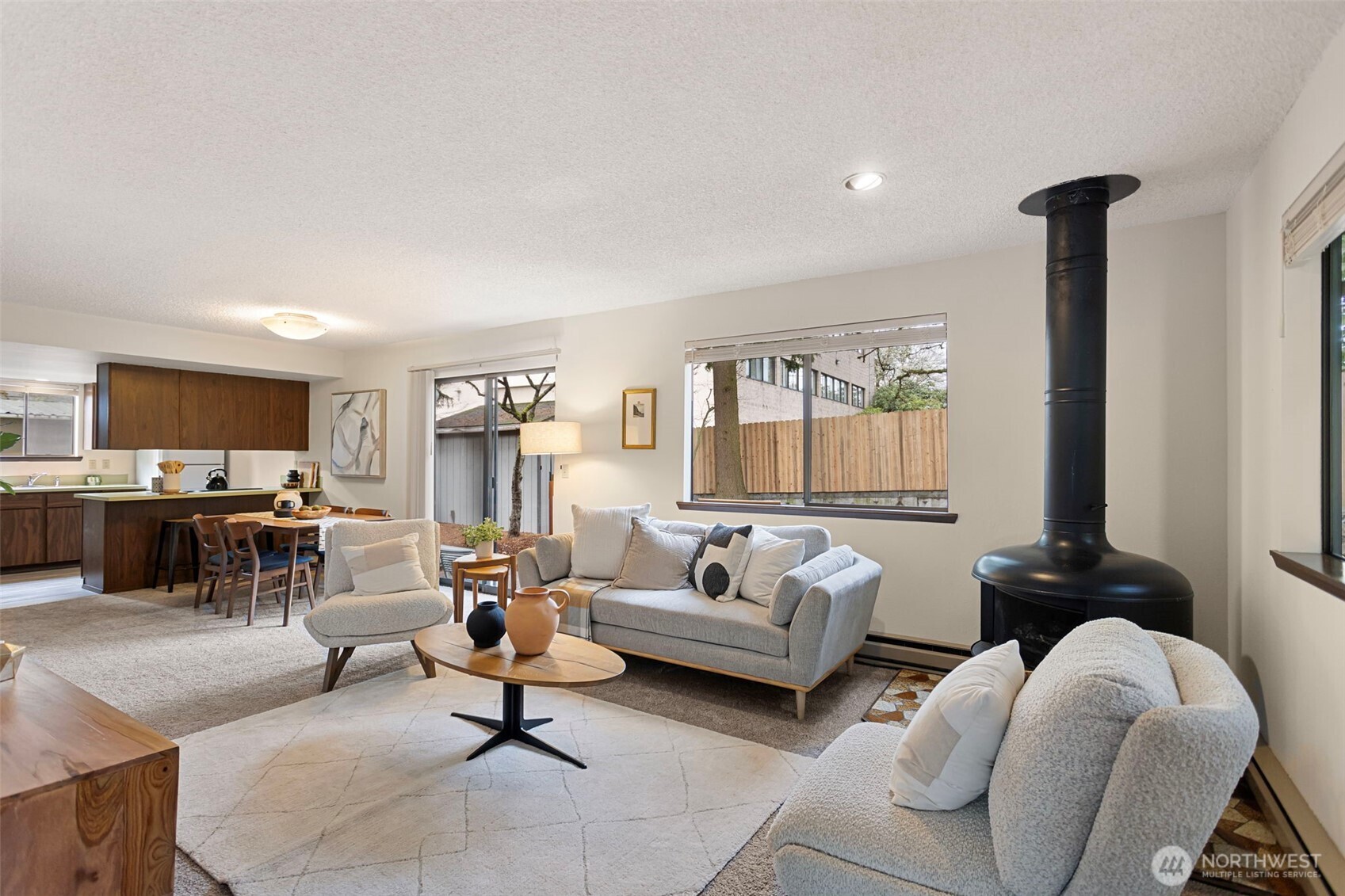 9545 Interlake Avenue North Seattle, WA 98103 - Photo 3 of 32 a living room with furniture and a flat screen tv