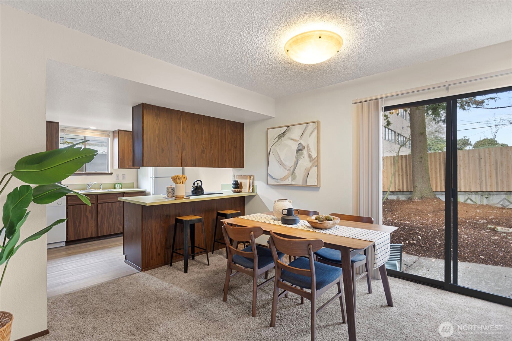 9545 Interlake Avenue North Seattle, WA 98103 - Photo 8 of 32 a view of a dining room with furniture window and outside view