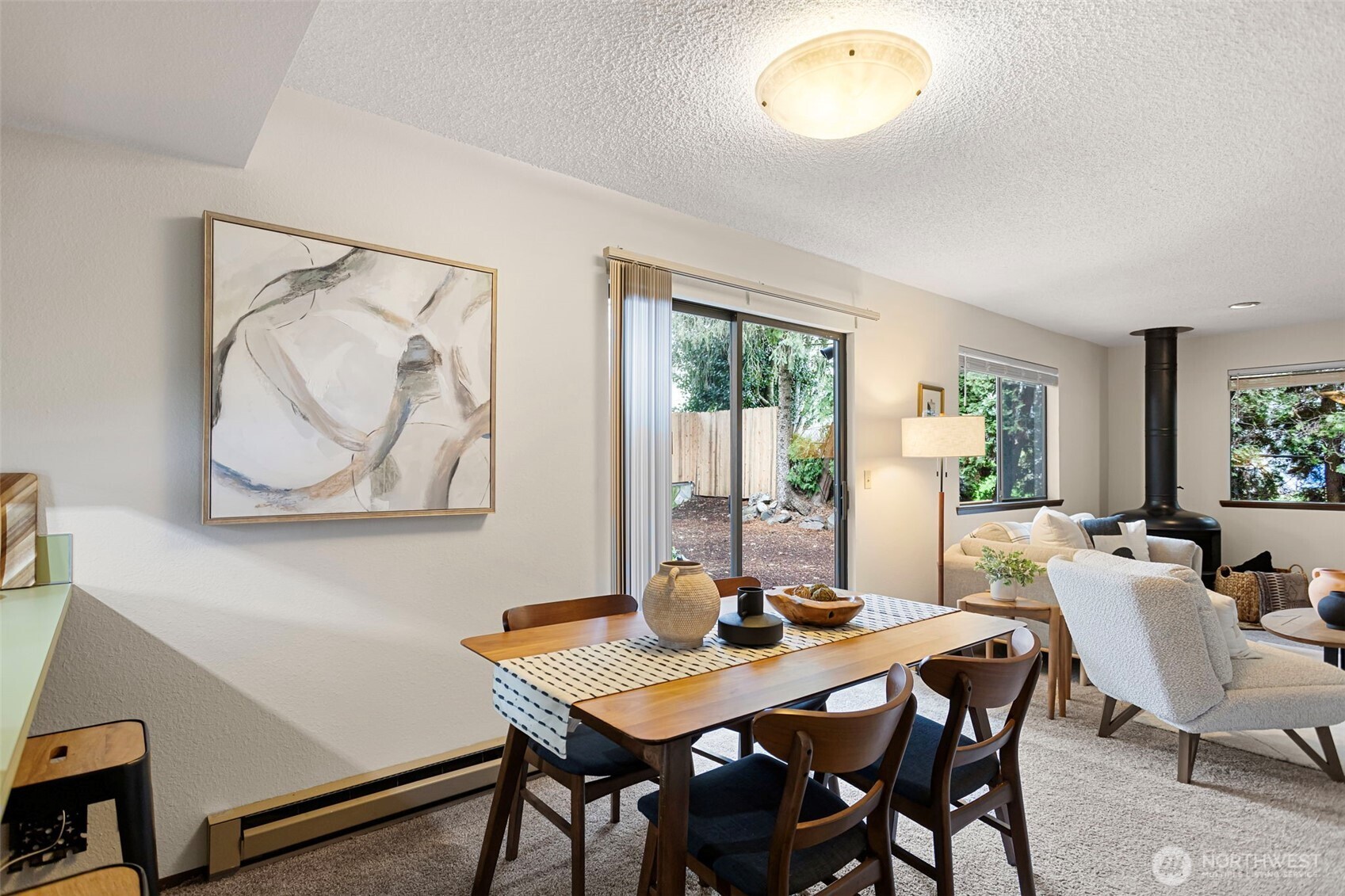 9545 Interlake Avenue North Seattle, WA 98103 - Photo 10 of 32 a view of a dining room with furniture and a potted plant
