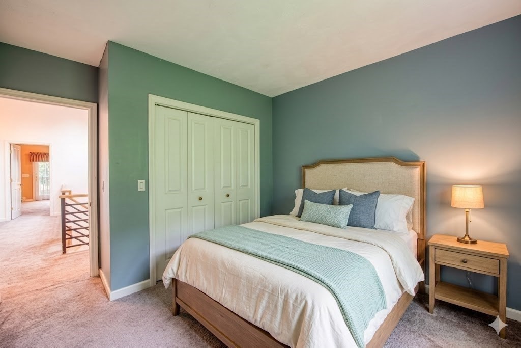 7 Tisdale Road Sharon, MA 02067 - Photo 25 of 37 a bedroom with a bed and a lamp