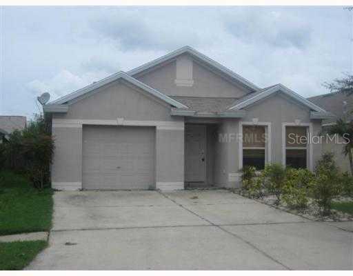 7618 Devonbridge Garden Way Apollo Beach, FL 33572 - Photo 1 of 1 a front view of a house with garage