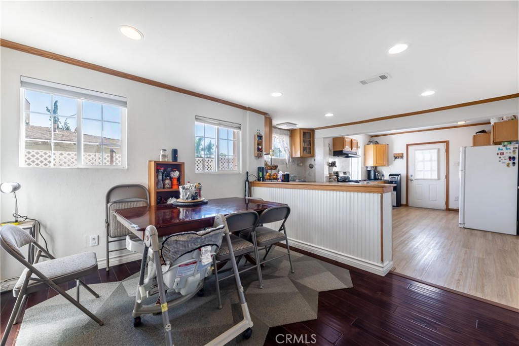 11203 Sheldon Street Sun Valley, CA 91352 - Photo 18 of 57 a dining room with furniture and wooden floor