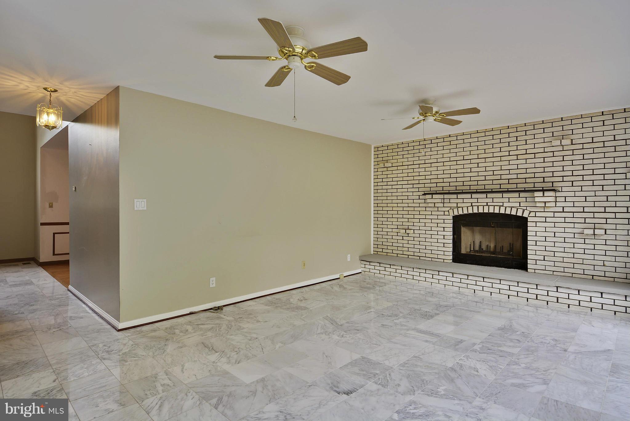 15737 Holly Grove Road Silver Spring, MD 20905 - Photo 13 of 30 Fireplace anchors family room