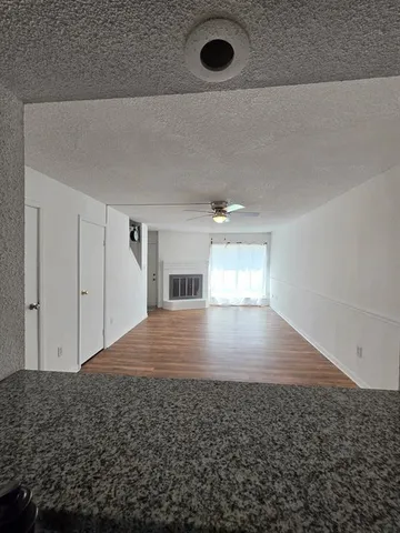 a view of a hallway to a bedroom