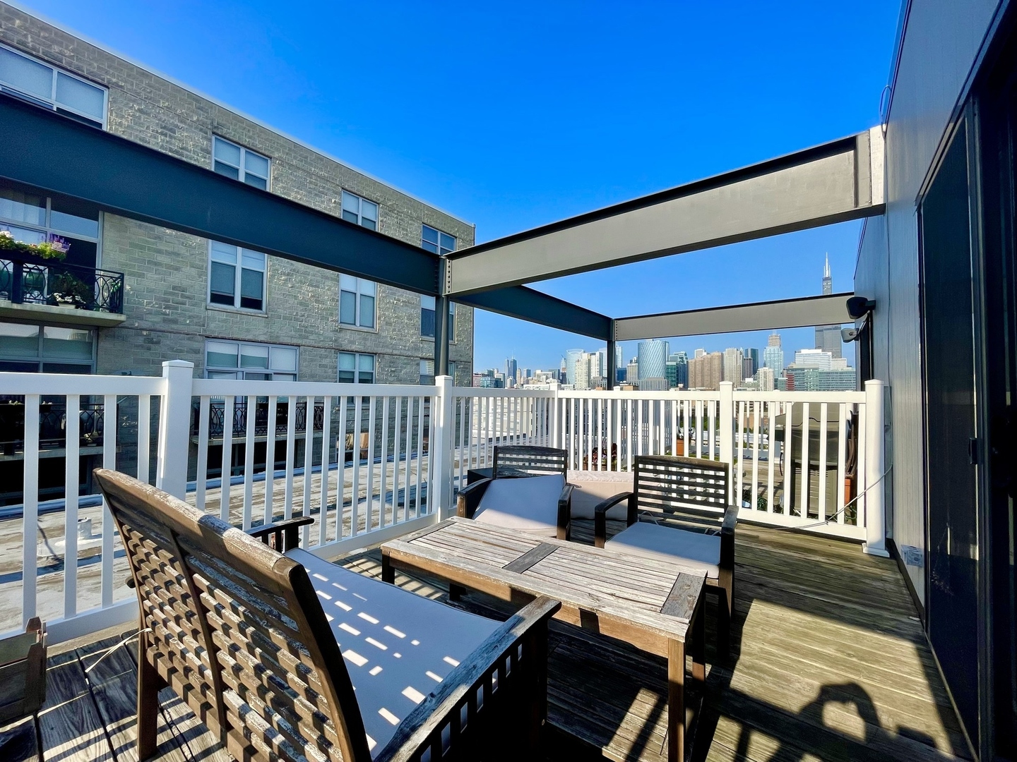 222 South Racine Avenue, Unit 607 Chicago, IL 60607 - Photo 18 of 22 a view of a balcony with furniture