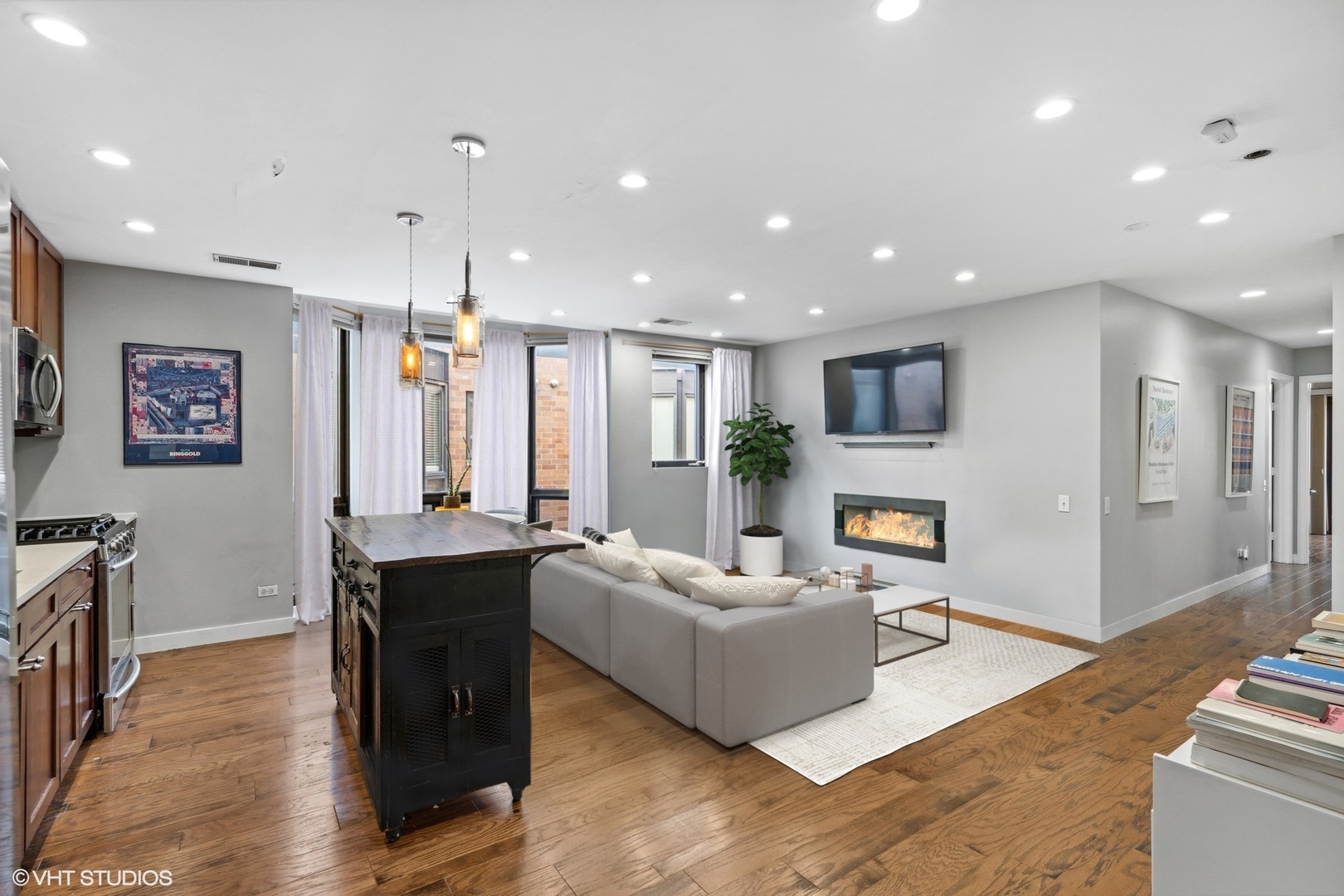 222 South Racine Avenue, Unit 607 Chicago, IL 60607 - Photo 3 of 22 a living room with stainless steel appliances furniture a rug and a view