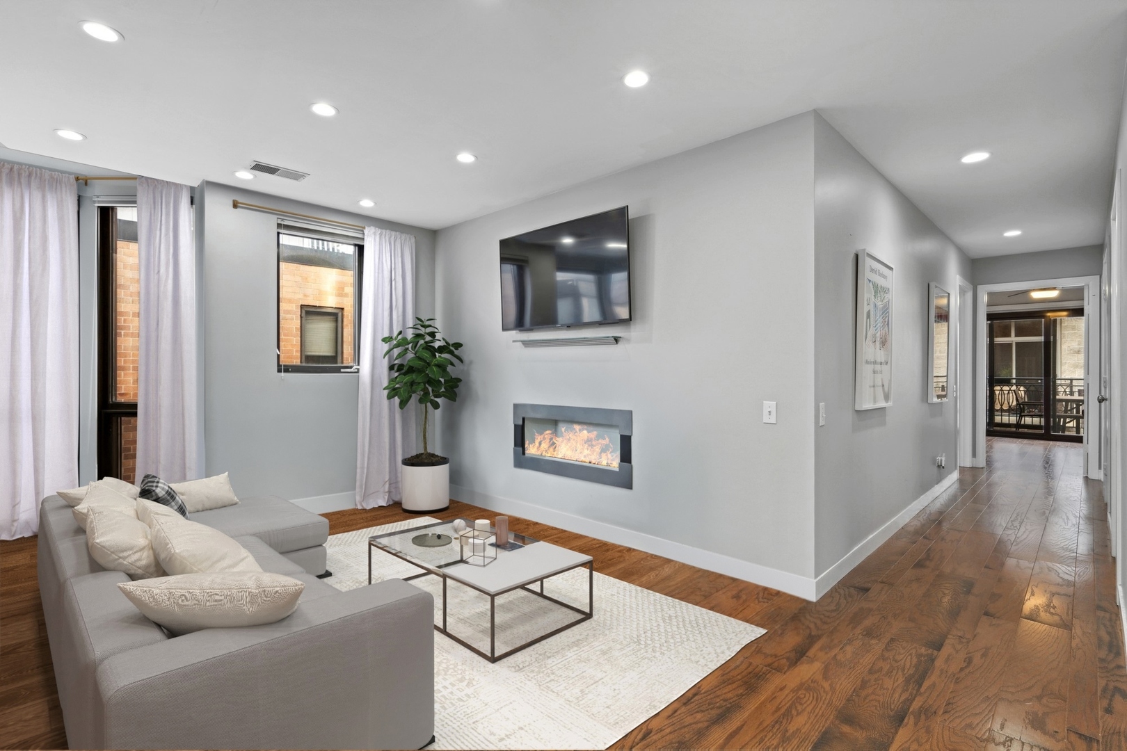222 South Racine Avenue, Unit 607 Chicago, IL 60607 - Photo 4 of 22 a living room with furniture and a wooden floor
