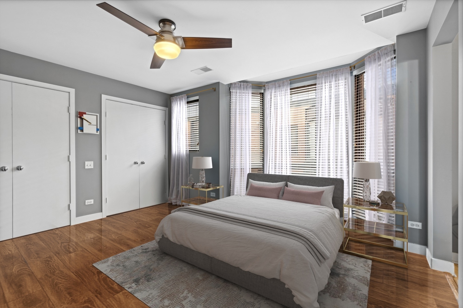 222 South Racine Avenue, Unit 607 Chicago, IL 60607 - Photo 9 of 22 a bedroom with a bed and a chandelier