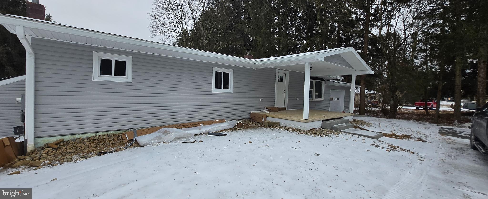 a view of a house with a yard and garage