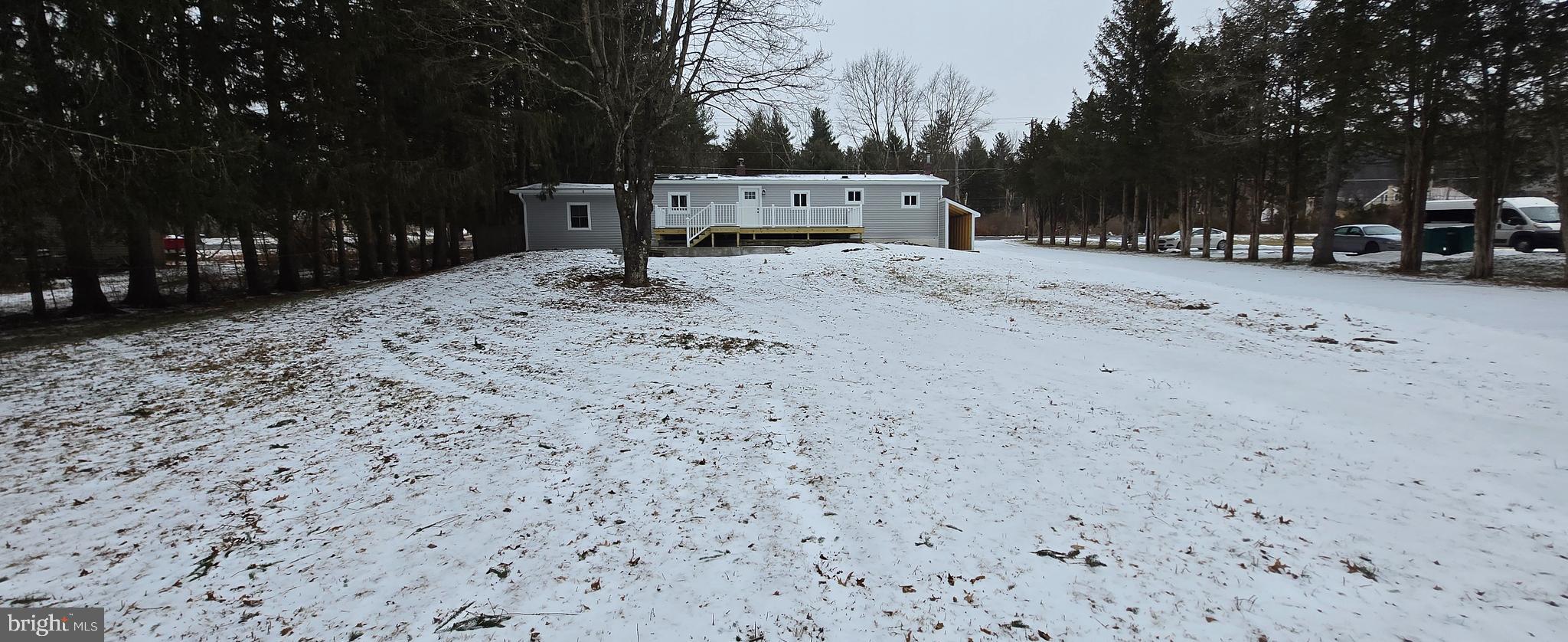 1040 Chestnut Road Orwigsburg, PA 17961 - Photo 14 of 14 a wooden bench sitting in middle of a yard