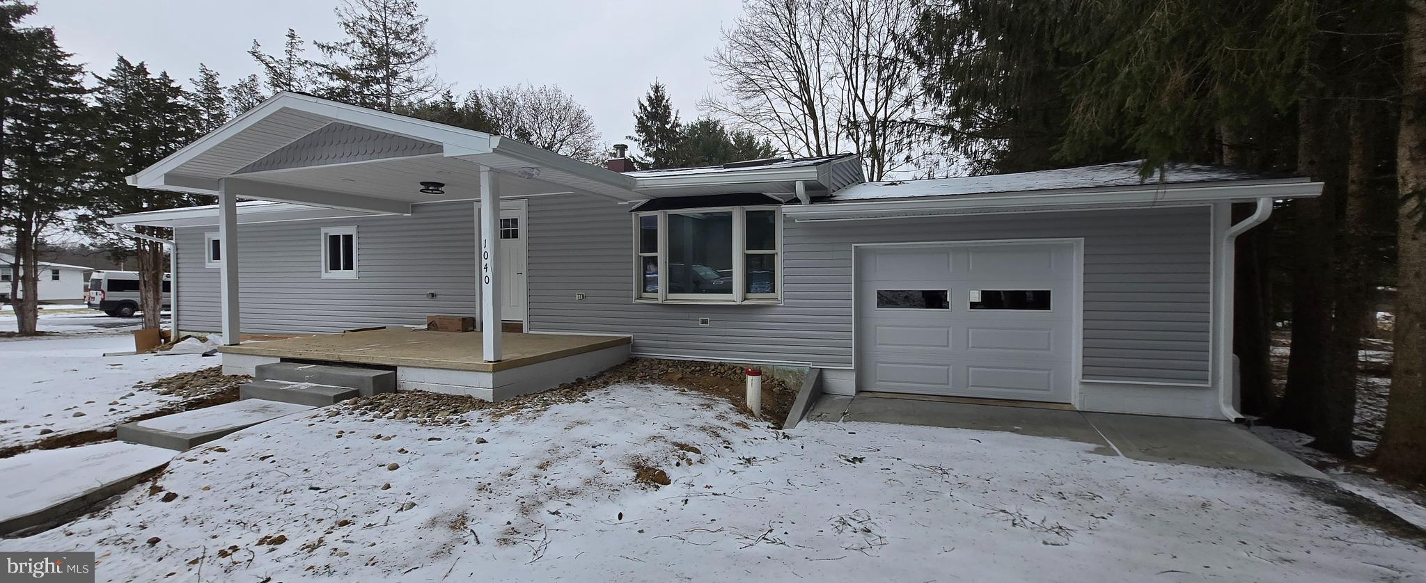 1040 Chestnut Road Orwigsburg, PA 17961 - Photo 3 of 14 a front view of a house with a yard