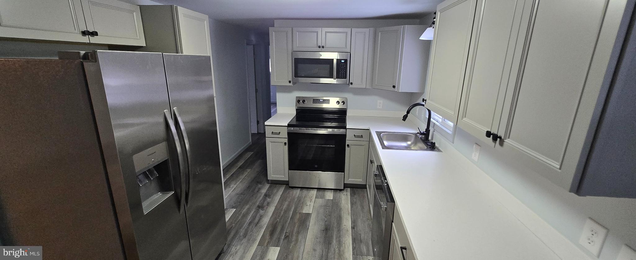 1040 Chestnut Road Orwigsburg, PA 17961 - Photo 4 of 14 a kitchen with stainless steel appliances a refrigerator and a stove
