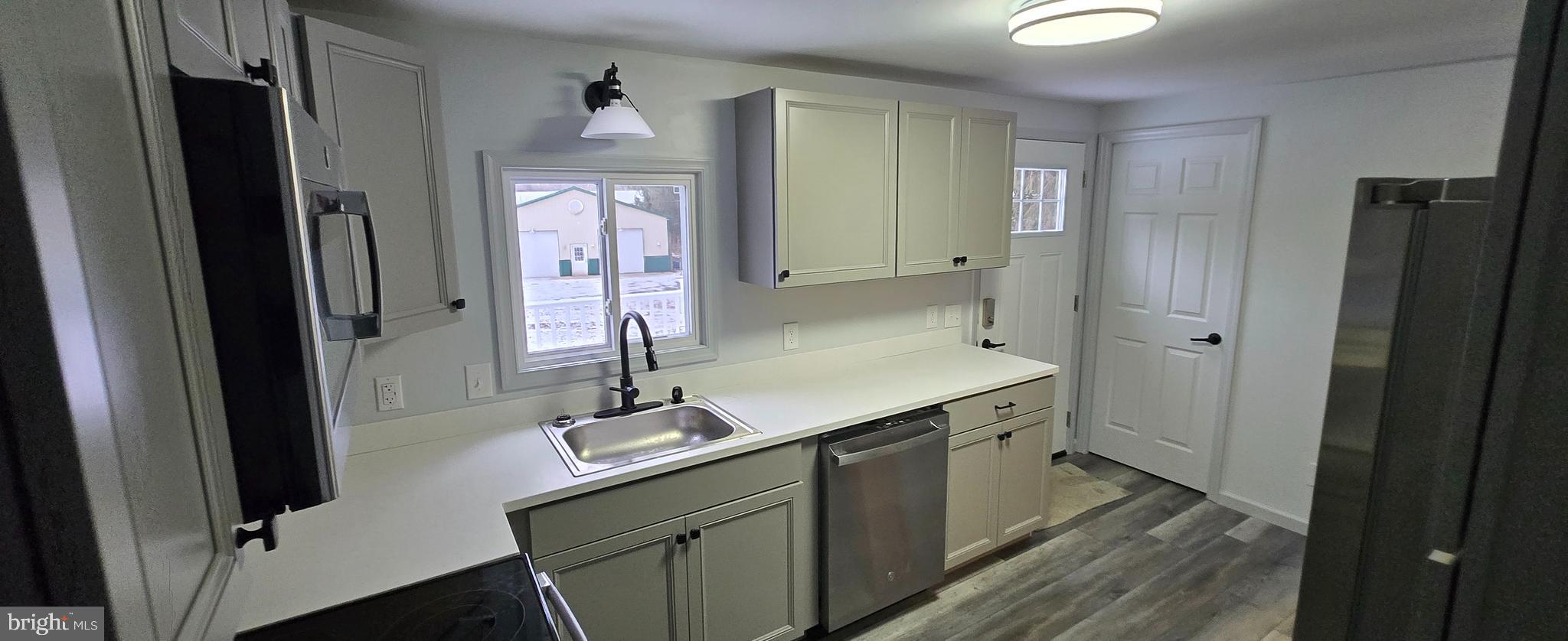 1040 Chestnut Road Orwigsburg, PA 17961 - Photo 5 of 14 a bathroom with a sink a mirror and a shower