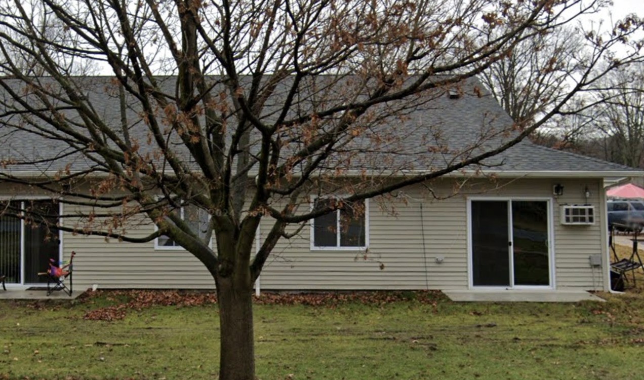 a house with trees in front of it