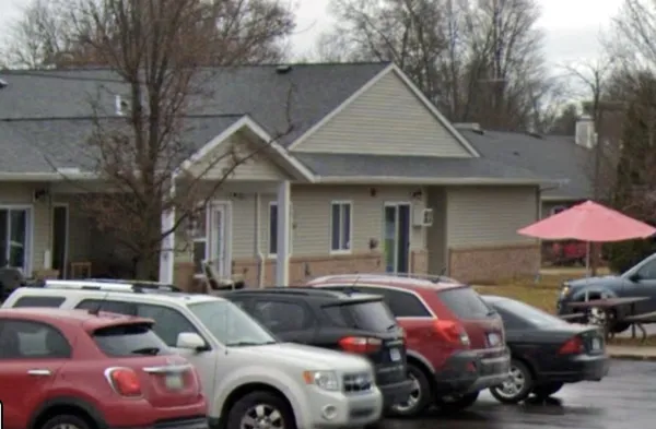 a front view of a house with parking space