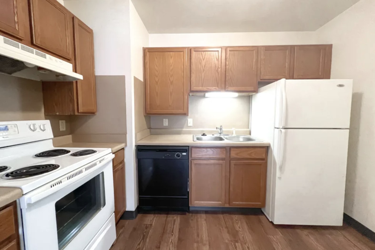 1500 Fruit Algonac, MI 48001 - Photo 5 of 12 a kitchen with a white stove top oven and refrigerator