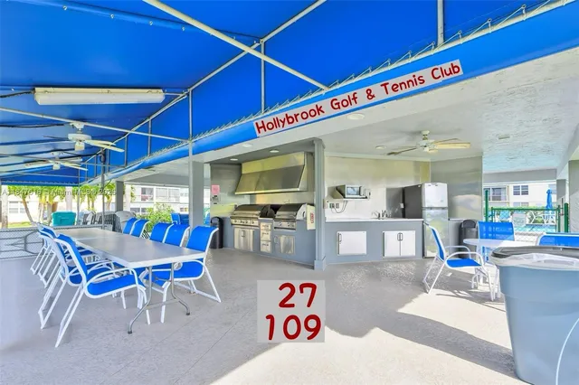 a view of a swimming pool with lounge chairs