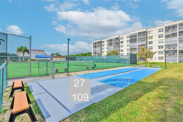 a view of a kitchen with a sink and a stove
