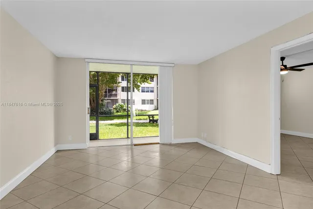 a view of an empty room with a window