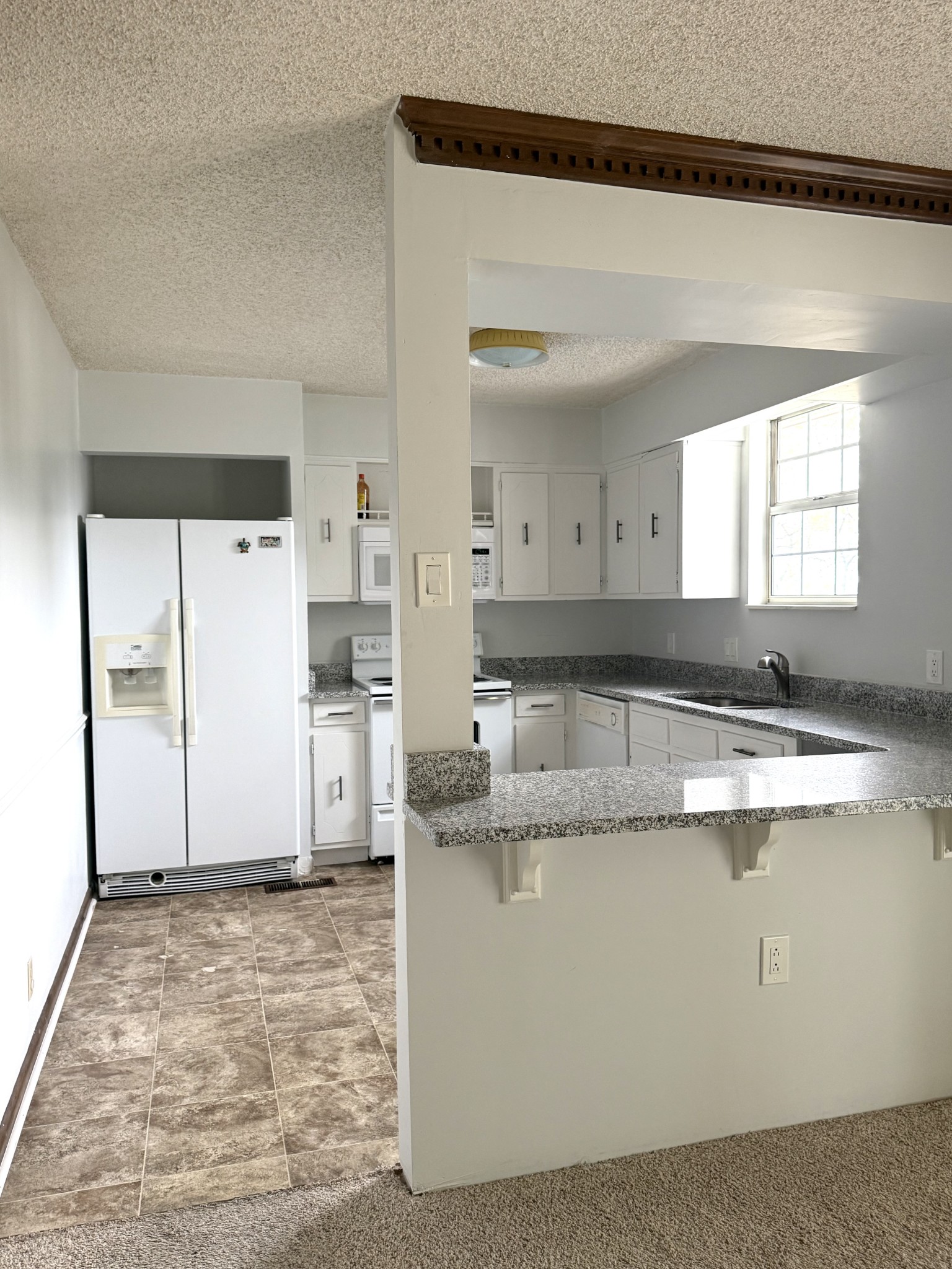 3308 Shakertown Road Antioch, TN 37013 - Photo 5 of 28 a kitchen with stainless steel appliances granite countertop a sink stove and refrigerator