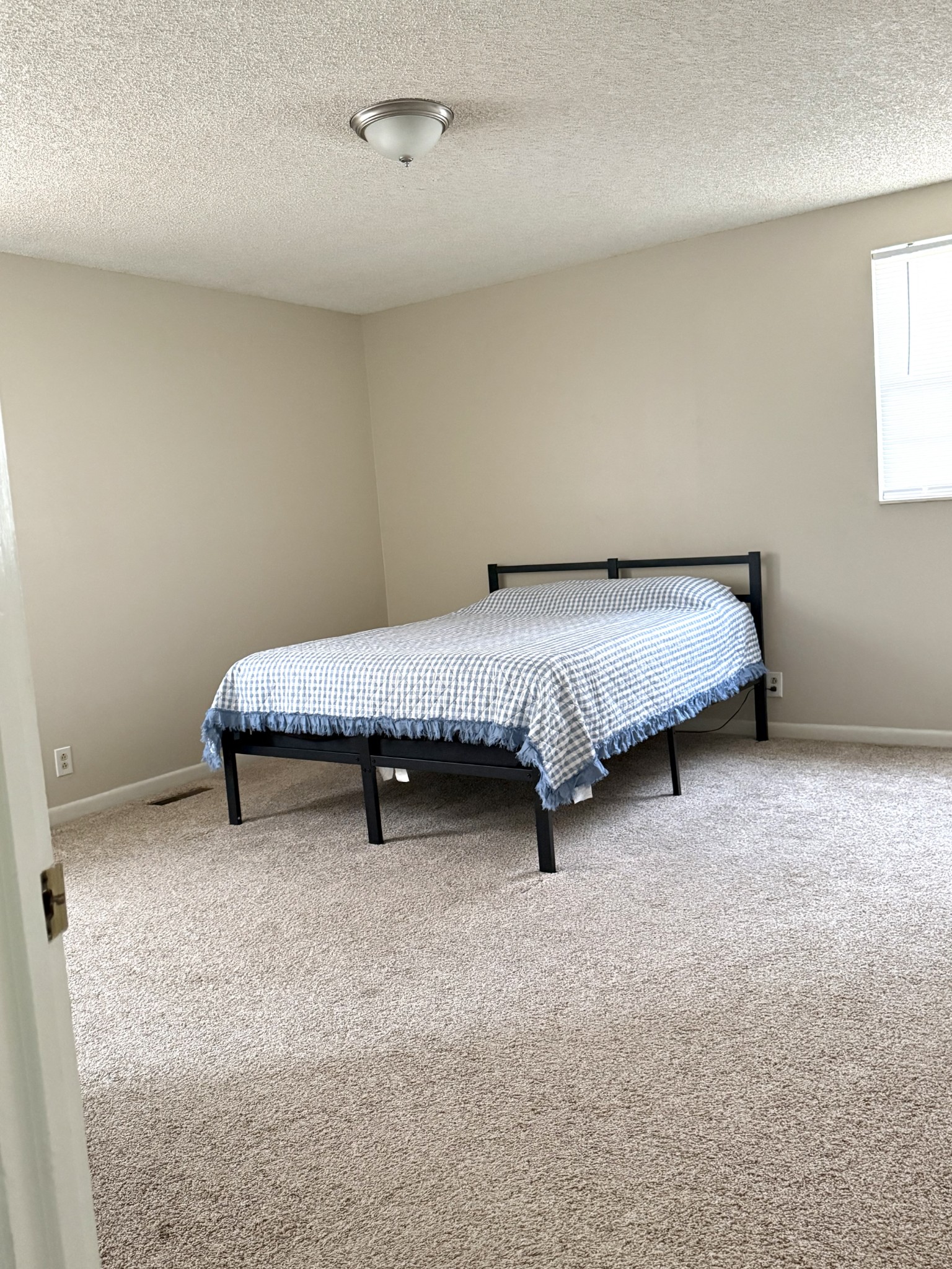 3308 Shakertown Road Antioch, TN 37013 - Photo 10 of 28 a spacious bedroom with a bed and window