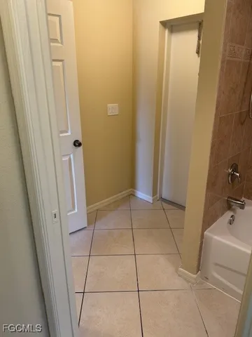 a bathroom with a sink and glass door shower